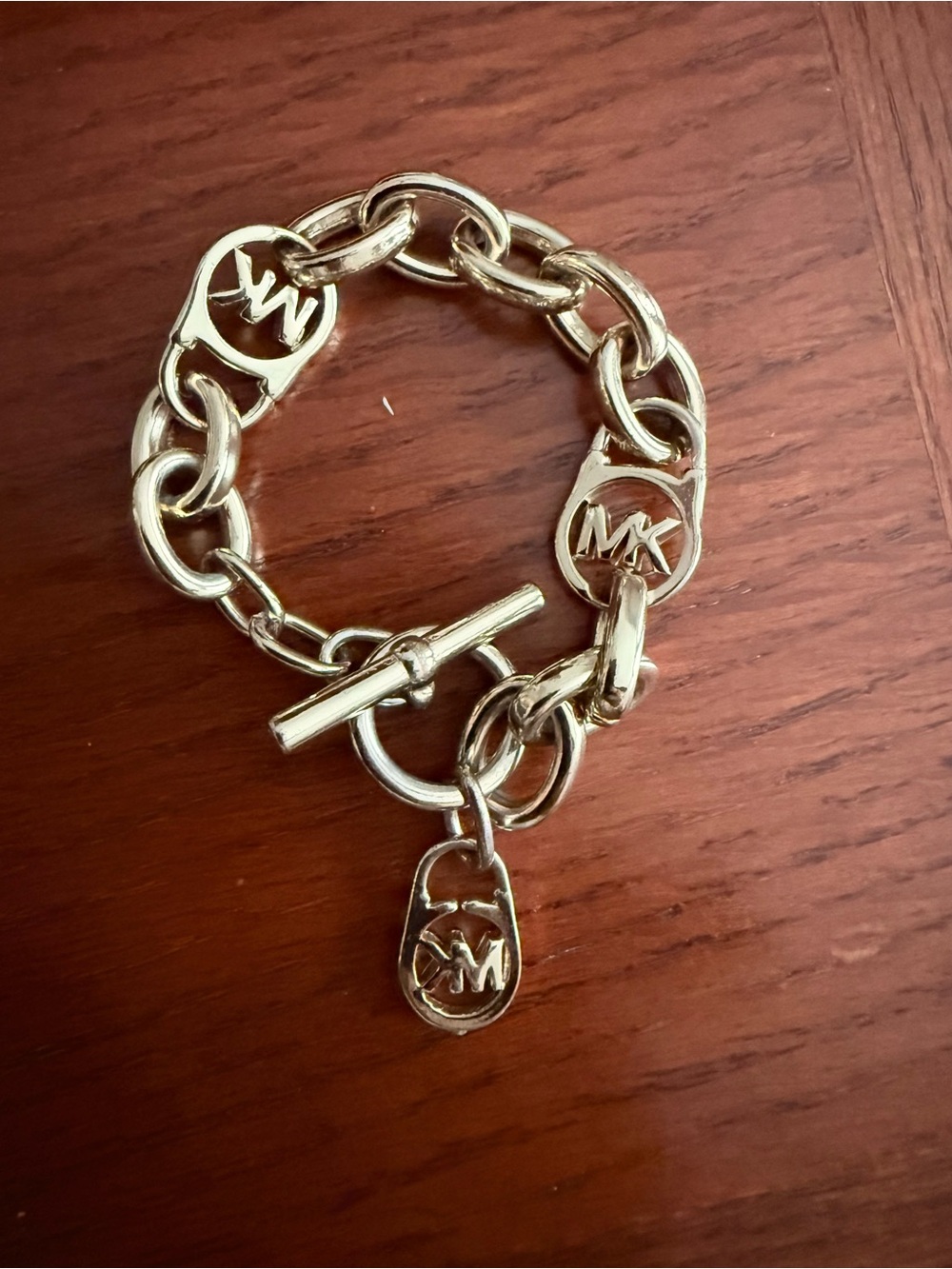 Michael Kors Gold Tone MK Logo Toggle Charm Bracelet